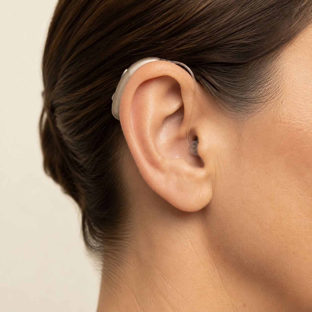 Receiver-in-canal hearing aid worn behind the ear